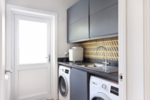 Utility room with door to outside- click for photo gallery